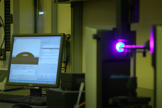 Dyne testing equipment is used to measure the contact angle of an adhesive and calculate its surface energy.